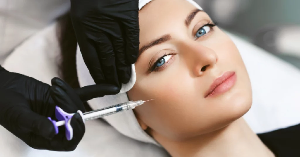 Close-up of a woman receiving facial injections from a professional, illustrating Dermal Filler Injector Training in Houston, TX.