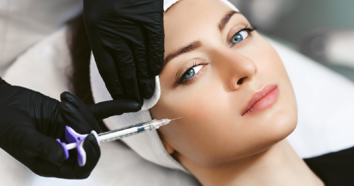 Close-up of a woman receiving facial injections from a professional, illustrating Dermal Filler Injector Training in Houston, TX.